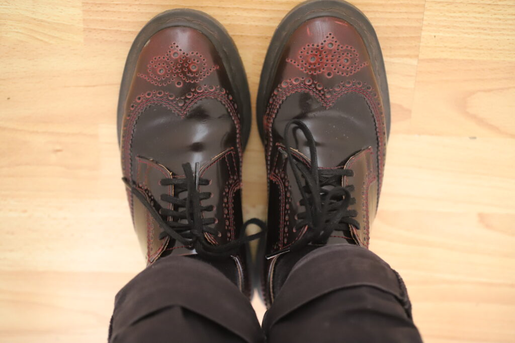 alt="woman wearing red shoes"