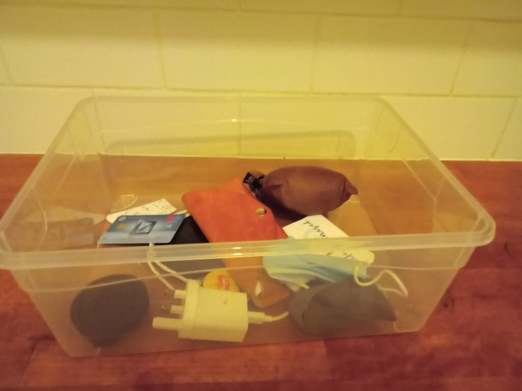 Plastic box with content of my handbag