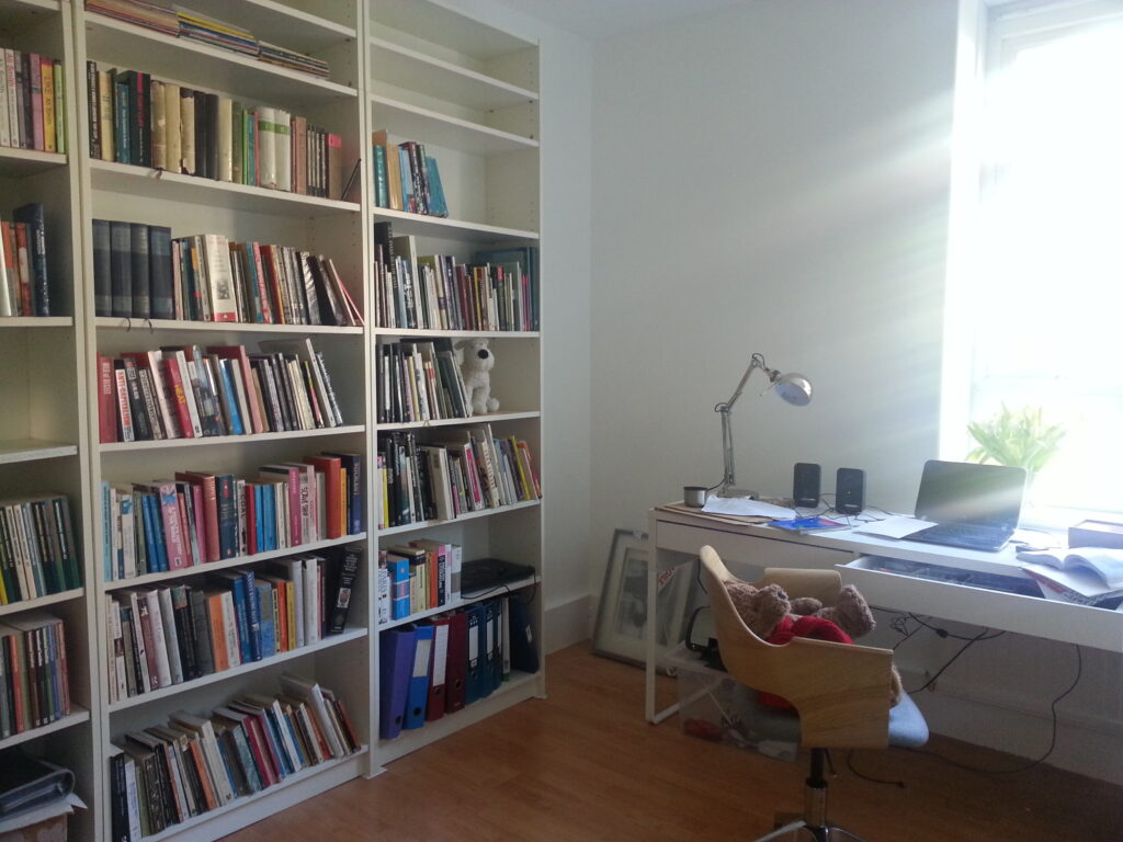 Home Office with bookshelf to illustrate 5 Simple Tips to Organise Your Office