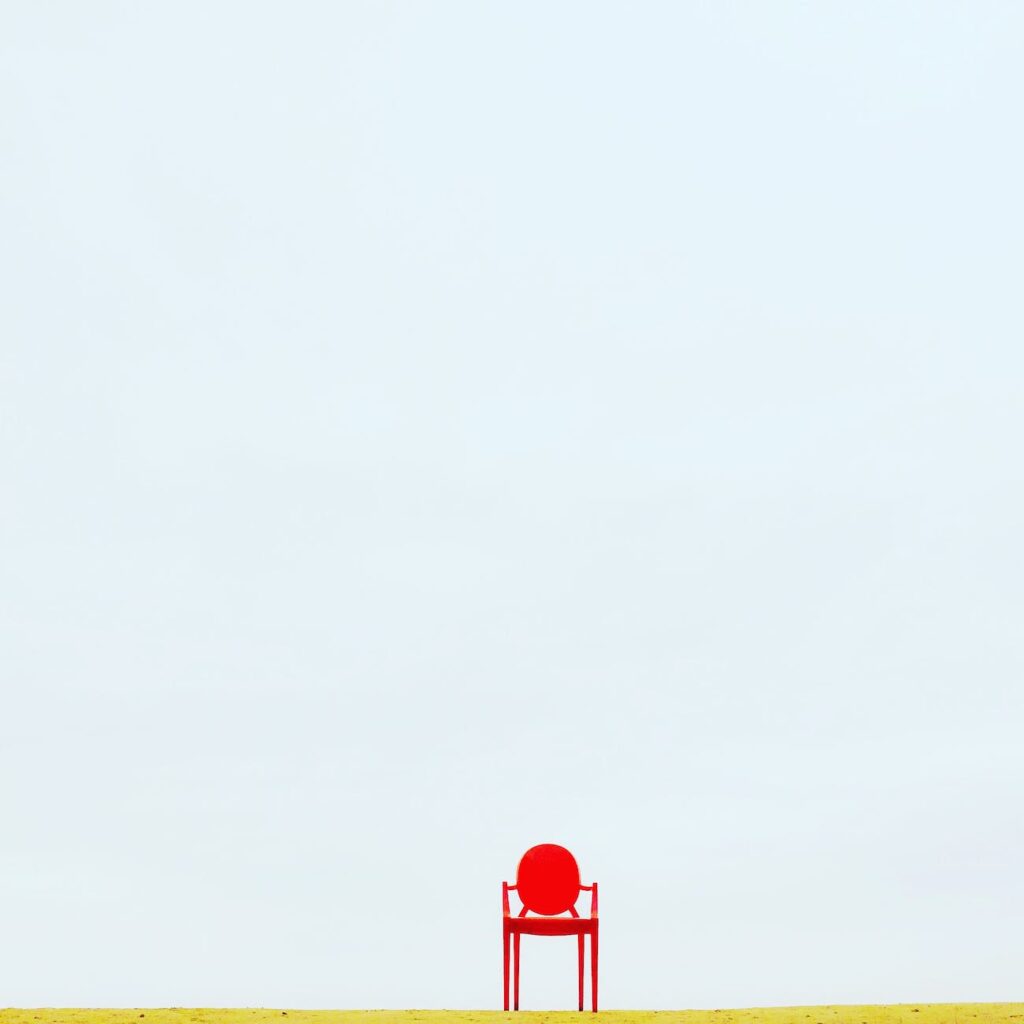 red armchair on brown surface