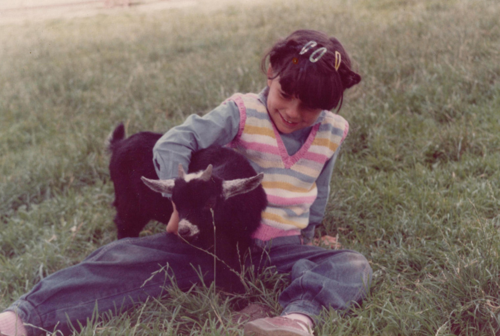 Bettina hugging a goat