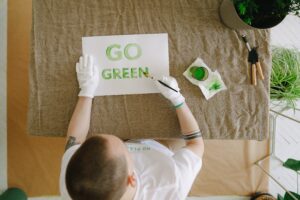 Child painting Go Green
