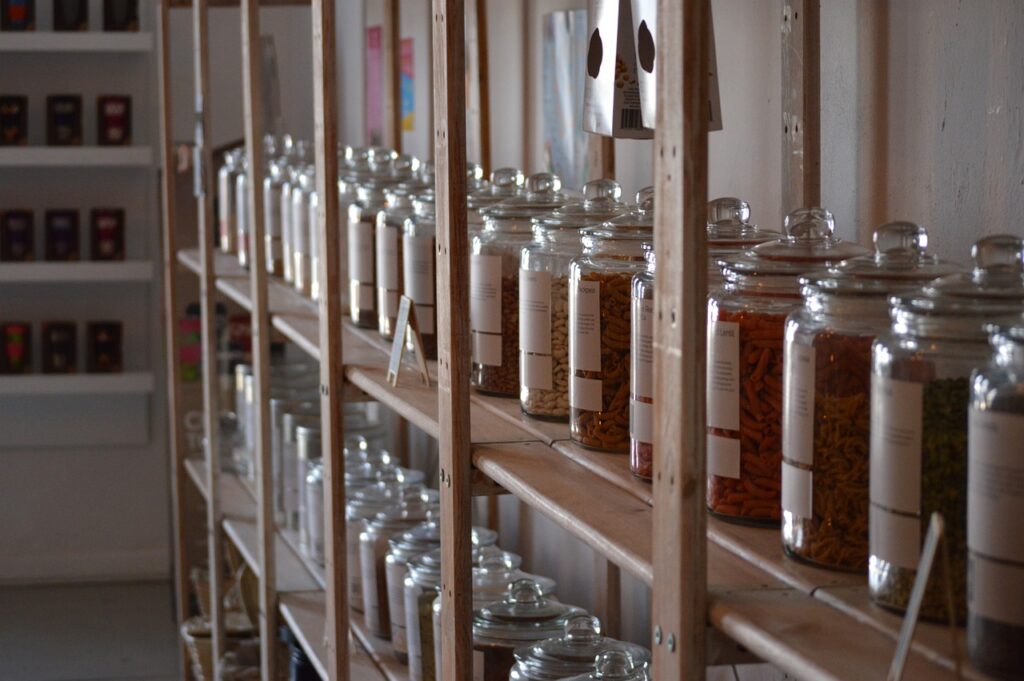 Shelf with produce in big glass jars