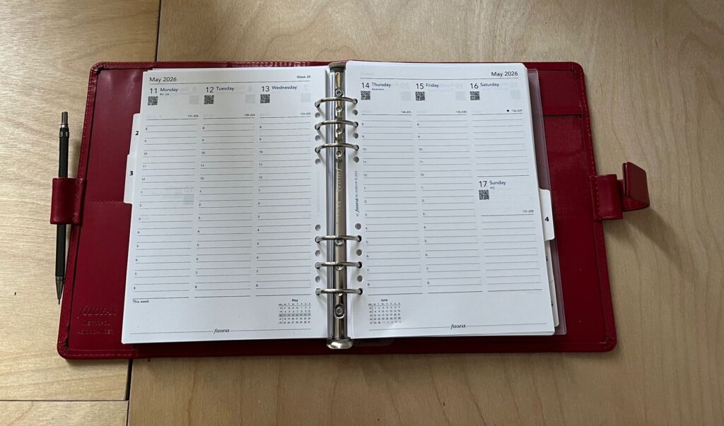 Red Fliofax, open showing a weekly spread
