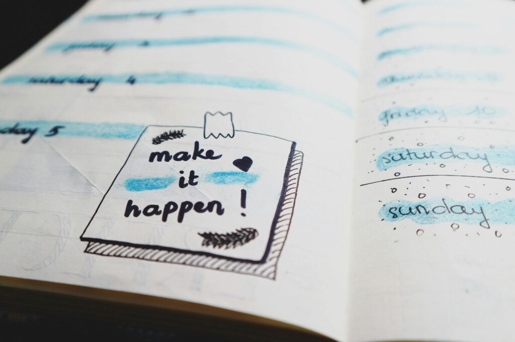 Bullet Journal that says: 'Make it happen'