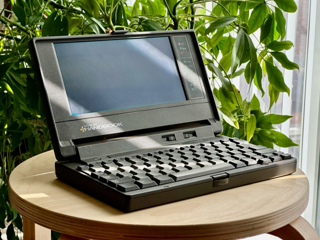 Black coloured 1980s laptop