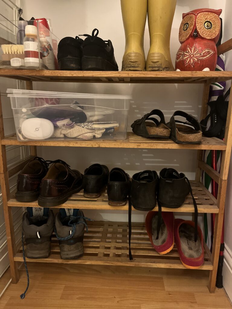 Shoe rack full of shoes