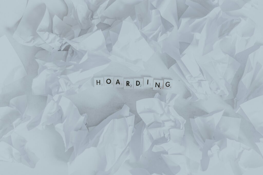 Hoarding spelt out in white scrabble pieces