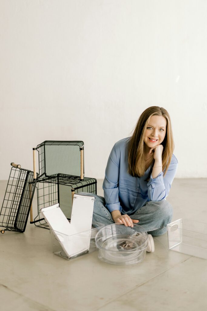 Women sitting on the floor with boxes