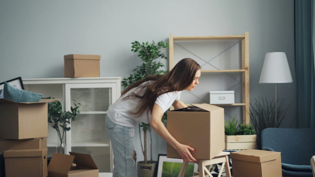 Woman with packing boxes