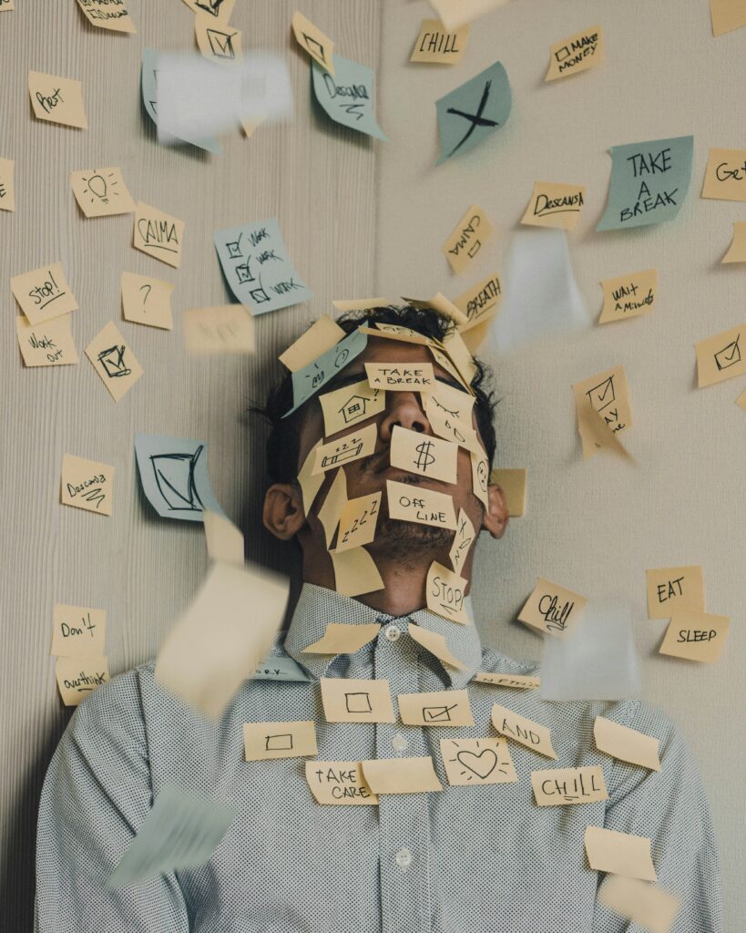 Men covered in post it nottes